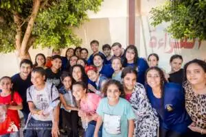 Coptic children and volunteers celebrating after field games
