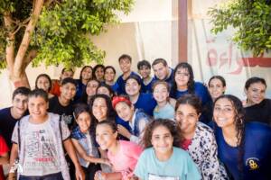 Coptic children and volunteers celebrating after field games